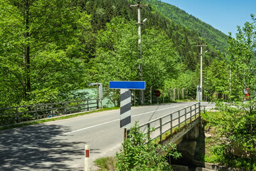 A scenic view of a roadway bridge crossing over a small body of water. Making this image perfect...