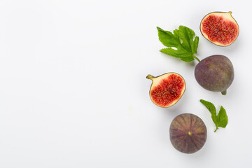 Fresh tasty fig fruits on color background, top view