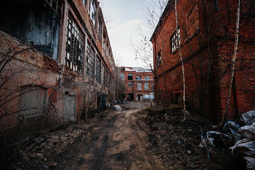 Territory of abandoned industrial area. Large old red brick industrial buildings
