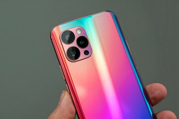 Sleek smartphone with gradient back and triple cameras