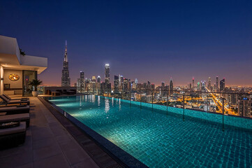 Stunning rooftop infinity pool with dubai skyline view