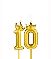 Golden number 10 birthday candle on white background