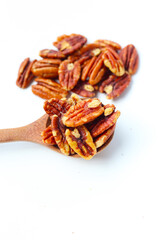 Delicious salted pecan nuts scattered.