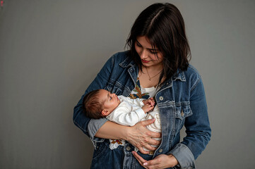 Tender moment of mother embracing her baby