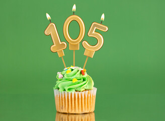 Birthday card with candle and cupcake - Number 105 on a green background