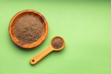 Piper nigrum - Aromatic black pepper in a bowl and spoon
