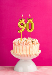 Number 90 birthday candle - Pink celebration cake with drip icing
