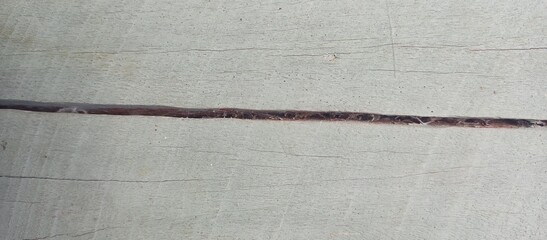 Subtle Cracked Wood Surface with Faint Gray Paint