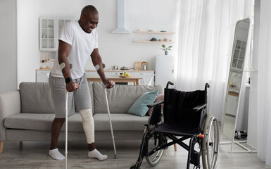 Surgery rehabilitation of bone and orthopaedic recovery, stay at home. Smiling adult african...