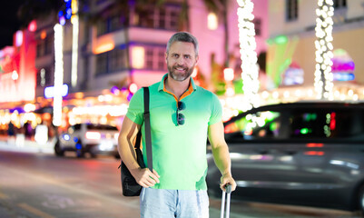 Traveling alone. Tourist on summer tropical street as he begins to travel through the city. Summer...
