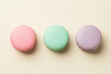 Obraz premium Pastel Macarons on Beige Background