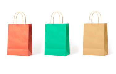 Set of orange, green and brown shopping bags isolated on white background.