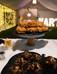 Sweet dessert table in a social event. Traditional patriotic Argentinian sweet pastries. Closeup...