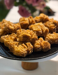 Traditional patriotic Argentinian sweet pastries. Closeup view of crispy pastelitos stuffed with quince and sweet potato jam