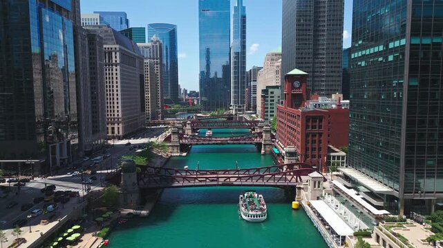 Tracking Aerial of Chicago Skyline with River and Tour Boats