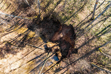 Aerial view of landslide on sandy slope of ravine due to undermining by melt water