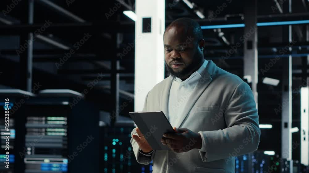 Poster server room admin doing troubleshooting to prevent downtime. it specialist in data center reviewing 