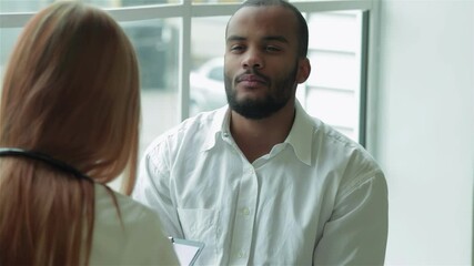 Patient attentively listens to his doctor's advice during a consultation