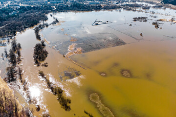 The floodplain, a natural area prone to flooding, was submerged by the river's overflow during the spring flood