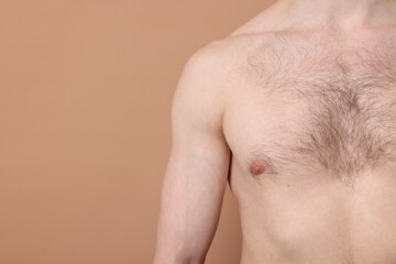 Man standing on beige background, closeup. Space for text