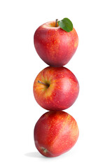 Red apples stacked on top of each other against white background. Balance