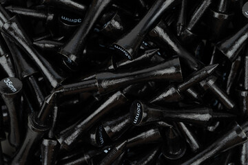 Black Golf Tees Close-Up – 35mm Sports Equipment Background