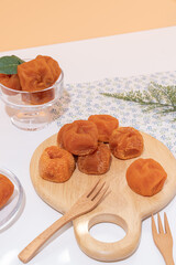 Traditional Korean Dried Persimmons on Wooden Board – Gotgam