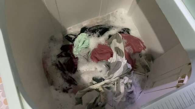 Washing clothes process inside top load washing machine