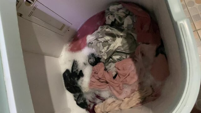 Washing clothes process inside top load washing machine