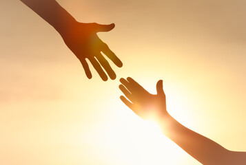 Silhouette of hands reaching out. Family support, trust together,  bonding,  Love, helping hand...