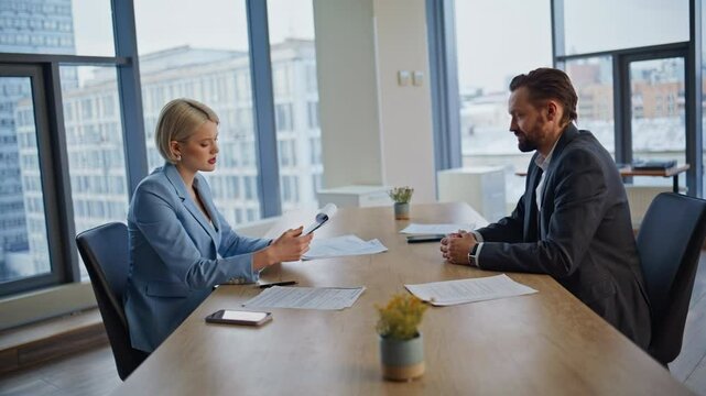 Corporate collaborators finalizing agreement at workspace. Investors handshake