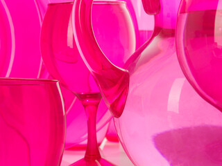empty glass bottles on pink background