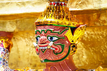 Colorful mythical guardian statue with ornate golden details
