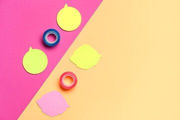 Composition with sticky notes and scotch tapes on color background