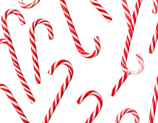 A scattering of red and white striped candy canes against a black background