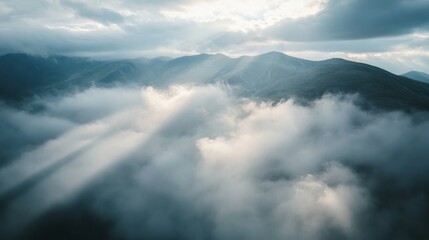 Obraz premium High-angle shot of a dense cloud cover over mountains aerial photography natural environment atmospheric viewpoint majestic nature scene