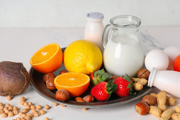 Different products on white table, closeup. Food Allergy Awareness Month