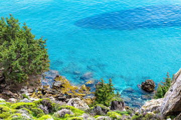 Saint George beach clear water aerial high angle view from Drakano tower fortress on Ikarian Sea,...
