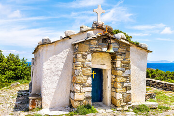 Small church of Saint George ancient Christian orthodox stone chapel exterior by Drakano tower in...