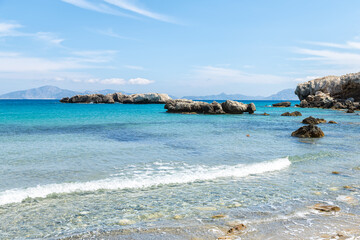 Saint George beach clear azure water from Drakano tower on Ikarian Sea, Greek Aegean islands of...