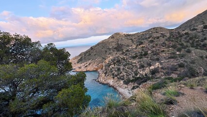 The breathtaking view showcases serene and calm waters encircled by stunningly beautiful hills and...