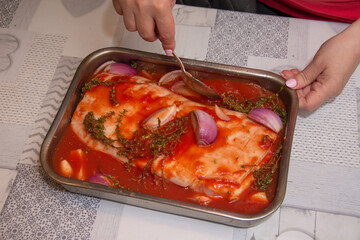 Pork prepared in tomato sauce with red onion, amazing food