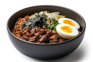 Side angle shot of a rich, flavorful bowl of Korean noodles topped with boiled egg halves, seaweed strips
