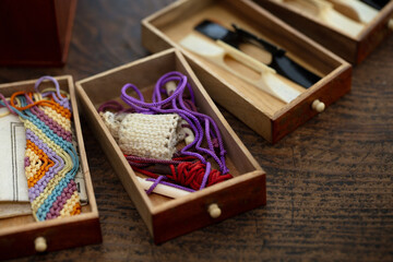 Items on a rustic Japanese desk. Shamisen instrument accessories placed in a small box. Traditional...
