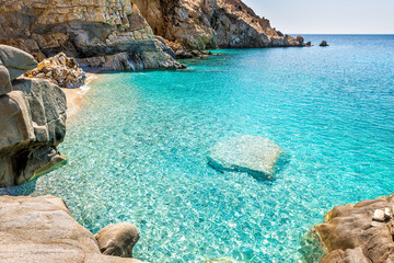 Seychelles beach at Magganitis, Ikaria island Greece by Icarian sea with crystal clear green...