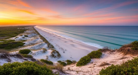 Vast Coastal Beach Landscape with Dramatic Sunset Sky and Rolling Dunes