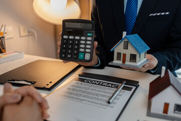 staff is explaining the information about the house lease contract documents to the buyer, the...