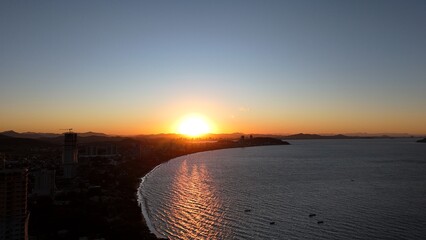 First light touches the ocean as the day begins — golden skies, calm seas, and nature in perfect...