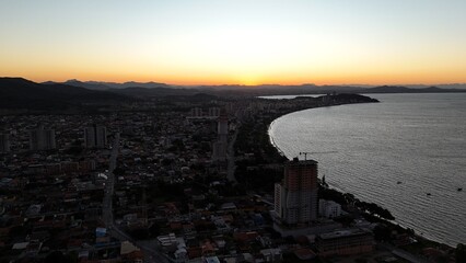 First light touches the ocean as the day begins — golden skies, calm seas, and nature in perfect...