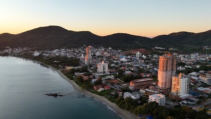 Fototapeta premium Sunrise and Sunset by the Sea – Calm Waters and Coastal Light in Brazi